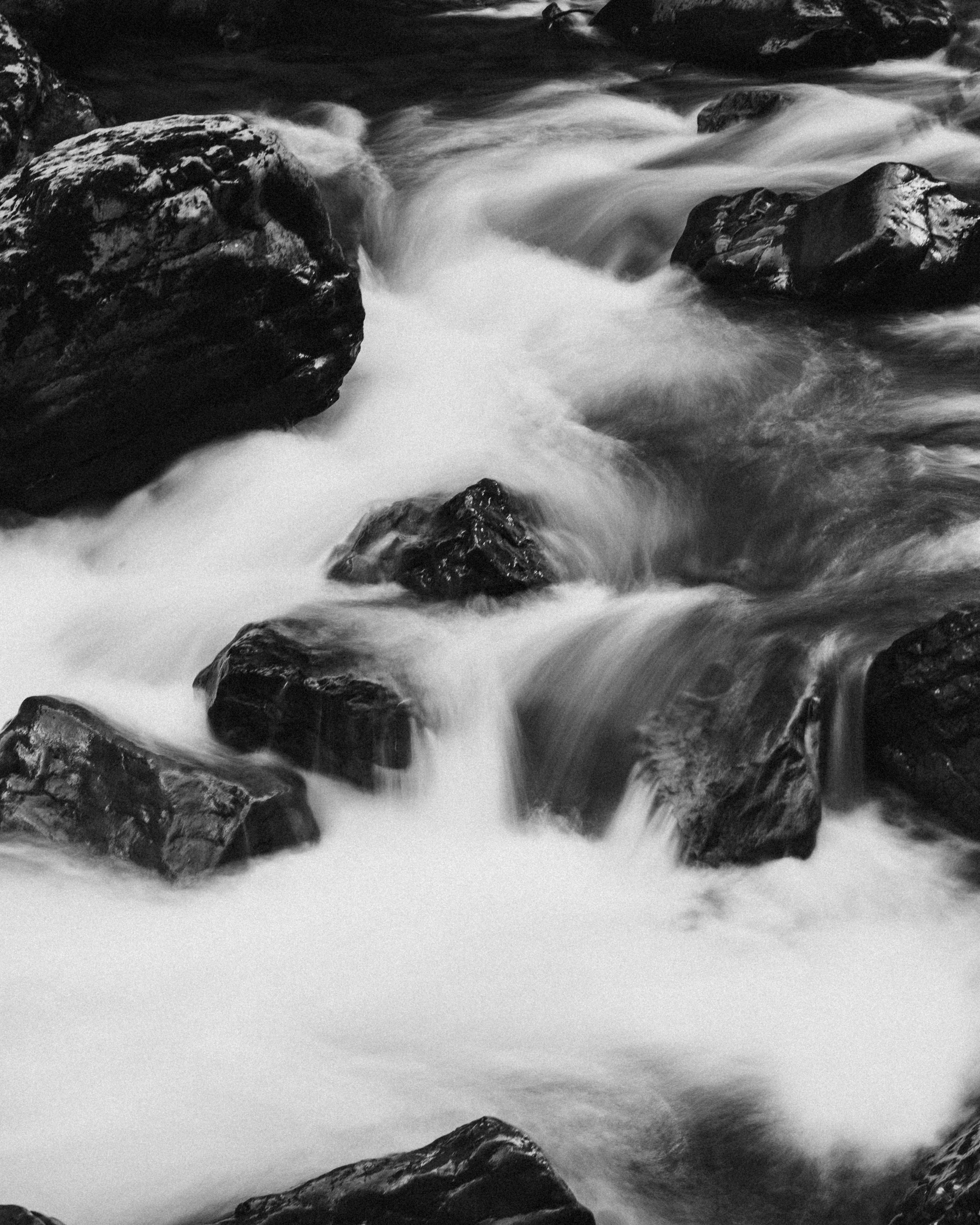 grayscale photo of water falls